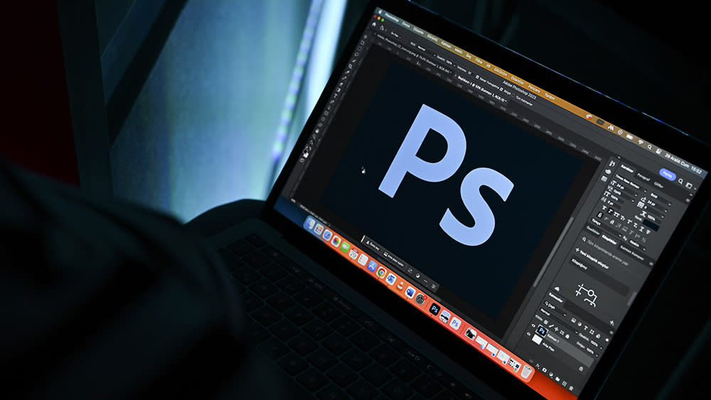  Adobe Photoshop logo in Photoshop on a laptop. 