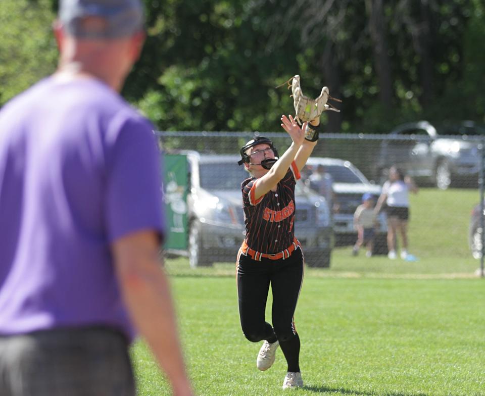 Leah Yunker makes a running catch for Sturgis in prep softball action on Wednesday.