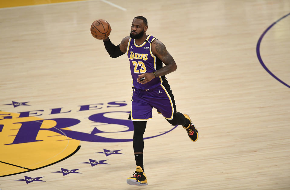 LOS ANGELES, CA - APRIL 30: LeBron James #23 of the Los Angeles Lakers dribbles the ball after returning to the starting lineup against the Sacramento Kings at Staples Center on April 30, 2021 in Los Angeles, California. NOTE TO USER: User expressly acknowledges and agrees that, by downloading and or using this photograph, User is consenting to the terms and conditions of the Getty Images License Agreement. (Photo by Kevork Djansezian/Getty Images)