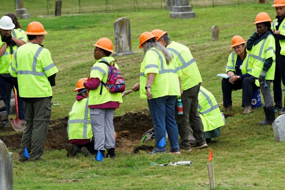 Crews working to excavate potential remains from the 1921 Tulsa race massacre are pictured 100 years later in 2021 (REUTERS)