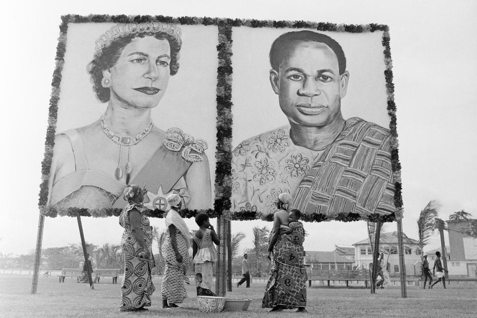 Huge portraits of Britain's Queen Elizabeth II and Ghana's President Kwame Nkrumah are displayed in Accra, Nov. 9, 1961, as the city prepares for the arrival of the British monarch on a state visit to Ghana. The queen and her husband, Prince Philip, Duke of Edinburgh, arrived in Accra by plane from London later that that day. (AP Photo, File)