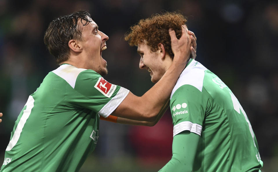 Josh Sargent, right, is congratulated by Werder Bremen captain Max Kruse after scoring on his Bundesliga debut. (Carmen Jaspersen/AP)