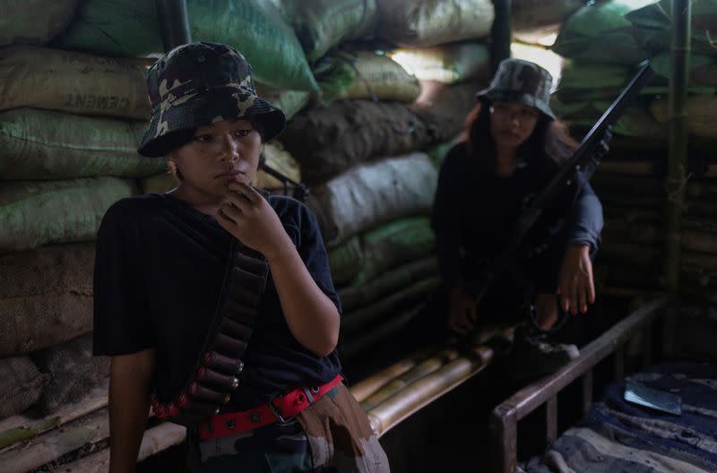 Hatey Haokip and Themboi Waibhai sit inside a bunker at a frontline village in Churachandpur district