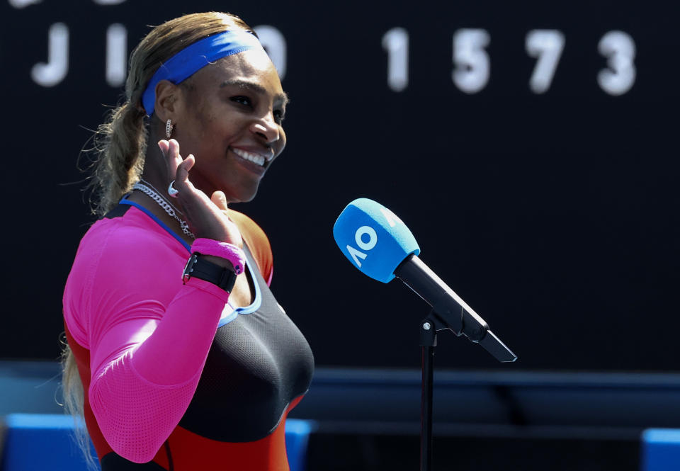 United States' Serena Williams waves as she is interviewed after winning her fourth round match against Aryna Sabalenka of Belarus at the Australian Open tennis championship in Melbourne, Australia, Sunday, Feb. 14, 2021.(AP Photo/Hamish Blair)