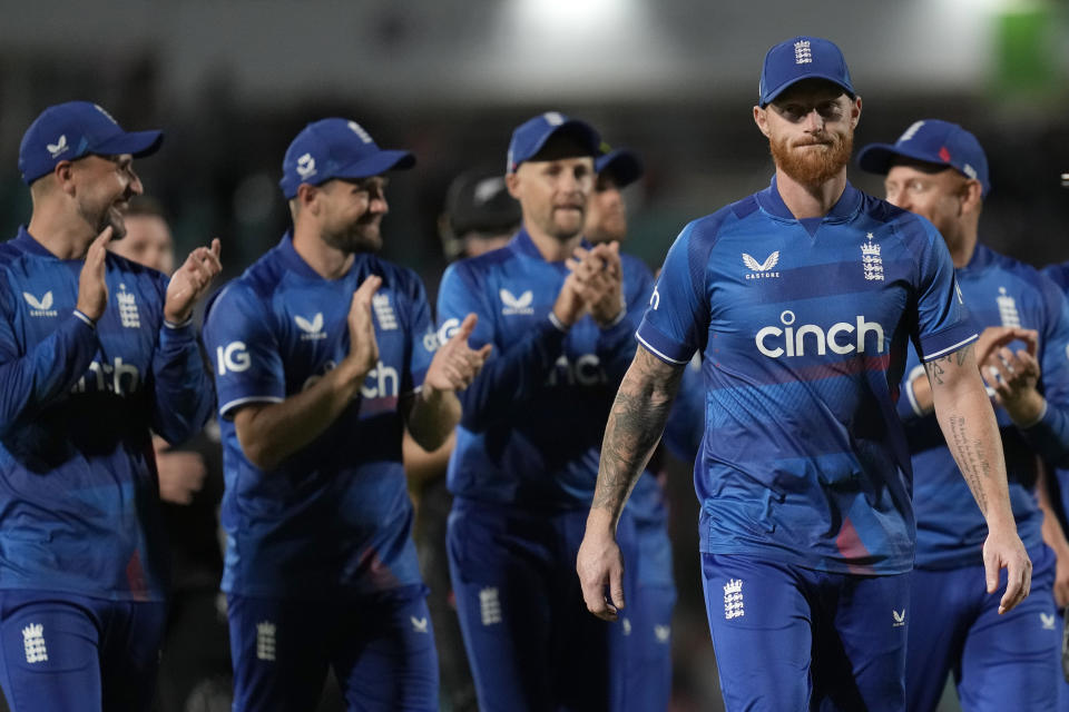 England players applaud England's Ben Stokes, right, as they leave the pitch after England win by 181 runs during the One Day International cricket match between England and New Zealand at The Oval cricket ground in London, Wednesday, Sept. 13, 2023. (AP Photo/Kirsty Wigglesworth)