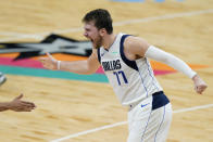 Dallas Mavericks guard Luka Doncic celebrates a score against the San Antonio Spurs during the second half of an NBA basketball game in San Antonio, Friday, Jan. 22, 2021. (AP Photo/Eric Gay)