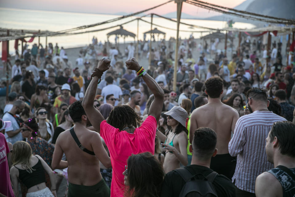 People dance during the Unum Festival at Rana e Hedhun beach on June 5, 2021 in Shengjin, Albania. 