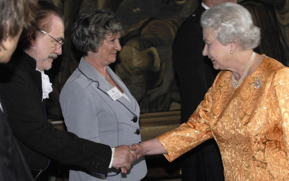 The Queen shakes the hand of actor Brian Cox during a reception, for those who have made a significant contribution to Scottish life, at the Palace of Holyroodhouse in Edinburgh.