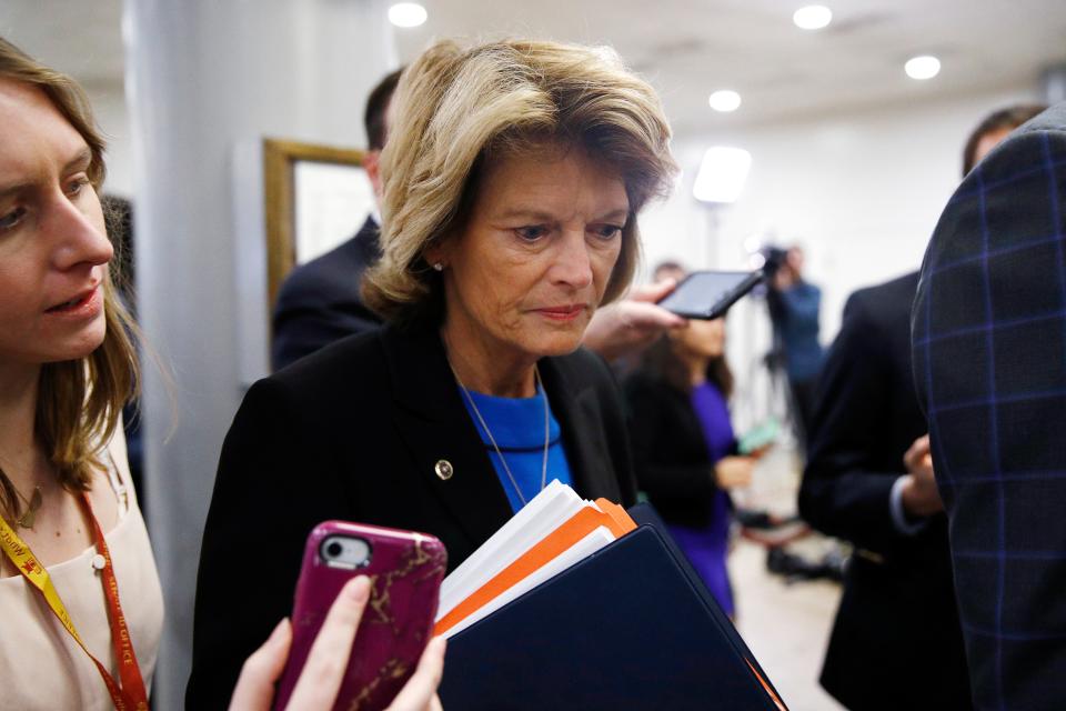 Sen. Lisa Murkowski, R-Alaska, speaks with reporters during the impeachment trial of President Donald Trump on Wednesday.