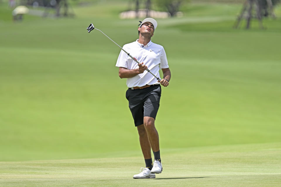 Eugenio Lopez-Chacarra from Spain reacts on the 9th hole during LIV Golf Invitational Bangkok 2022 at Stonehill Golf Club in Pathum Thani, Thailand, Saturday, Oct. 8, 2022. (AP Photo/Kittinun Rodsupan)