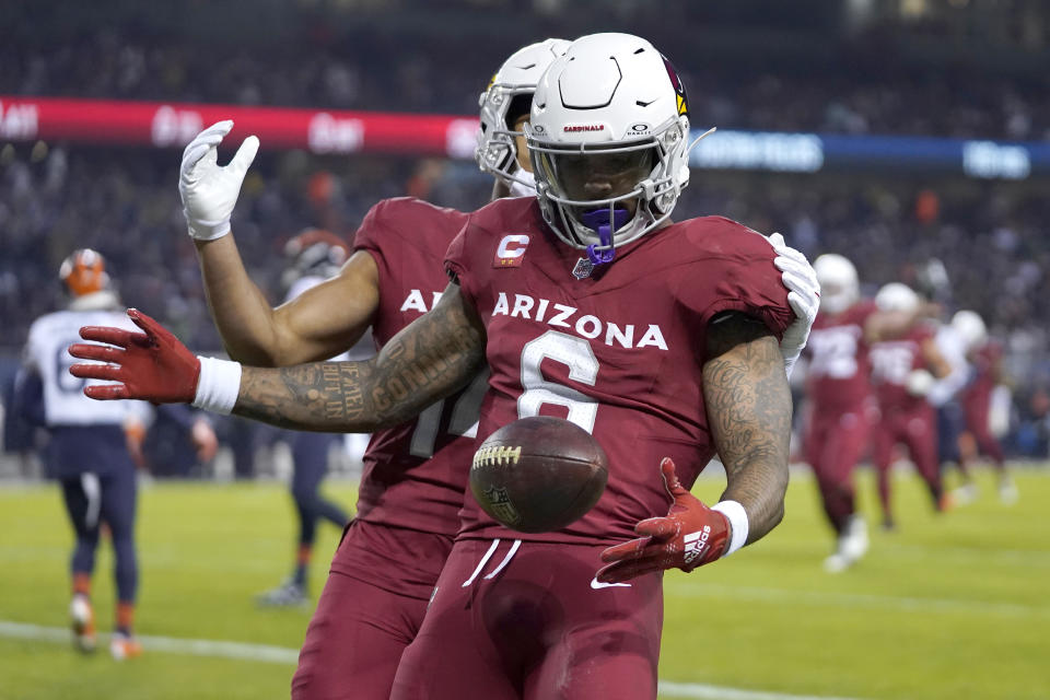 Arizona Cardinals running back James Conner celebrates his touchdown during the first half of an NFL football game against the Chicago Bears Sunday, Dec. 24, 2023, in Chicago. (AP Photo/Erin Hooley)