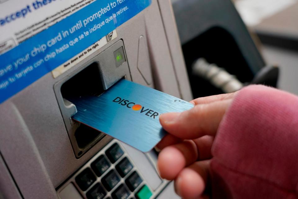 PHOTO: A Discover card is used to pay for gasoline at a Sam's Club in Madison, Miss., July 1, 2021. (Rogelio V. Solis/AP)