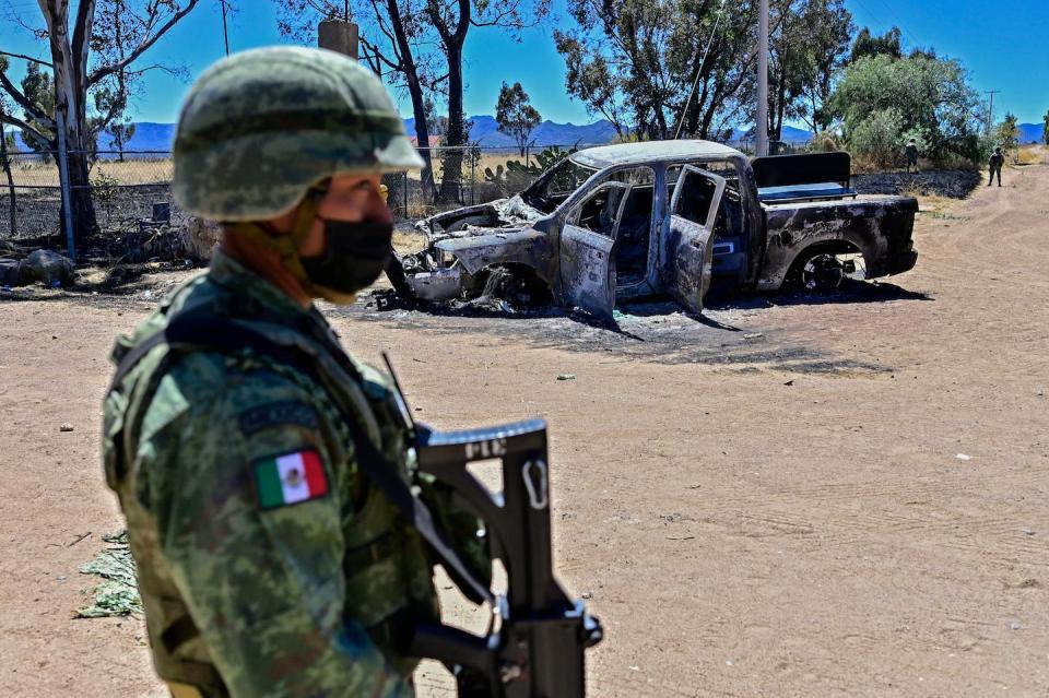 A Mexican soldier stands guard outside a crime scene in Zacatecas state, Mexico, in March 2022. <a href="https://media.gettyimages.com/id/1239480084/photo/mexico-crime-drugs-zacatecas.jpg?s=1024x1024&w=gi&k=20&c=QIgWwOpyu1WAXV3Gg_Glcrgk1cfGDkZlrbxj1J6DlRQ=" rel="nofollow noopener" target="_blank" data-ylk="slk:Pedro Pardo/AFP via Getty Images;elm:context_link;itc:0;sec:content-canvas" class="link ">Pedro Pardo/AFP via Getty Images</a>