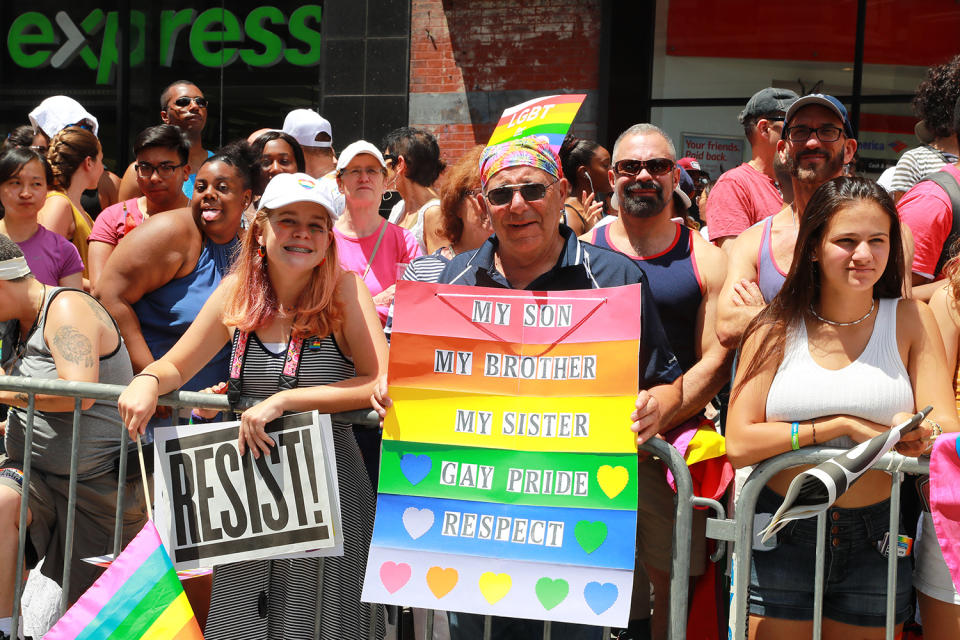 <p>A man holds a sign supporting family members during the N.Y.C. Pride Parade in New York on June 25, 2017. (Photo: Gordon Donovan/Yahoo News) </p>