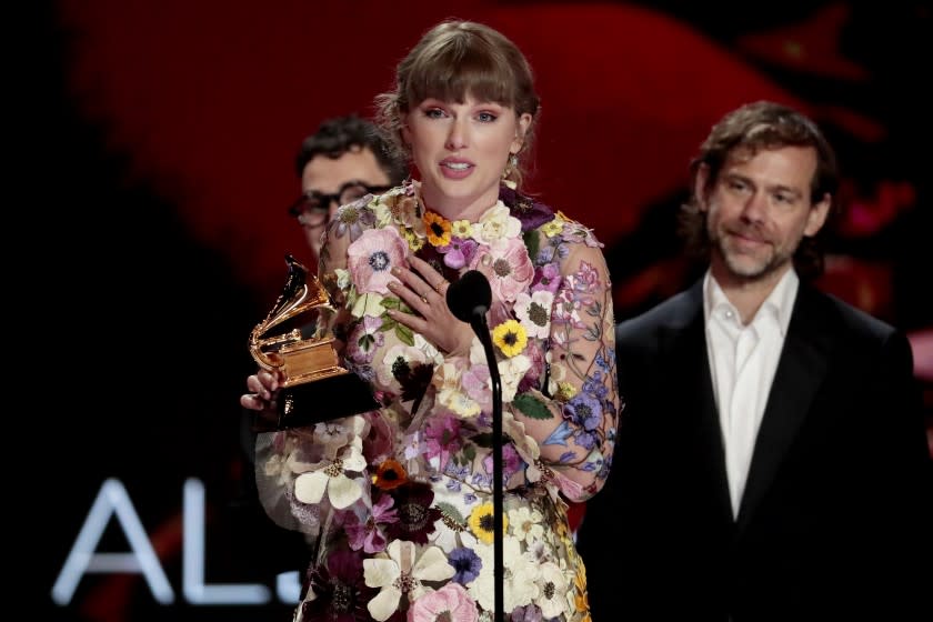 Los Angeles, CA, Sunday, March 14, 2021 - Taylor Swift accepts the award for Album of the Year at the 63rd Grammy Award outside Staples Center. (Robert Gauthier/Los Angeles Times)