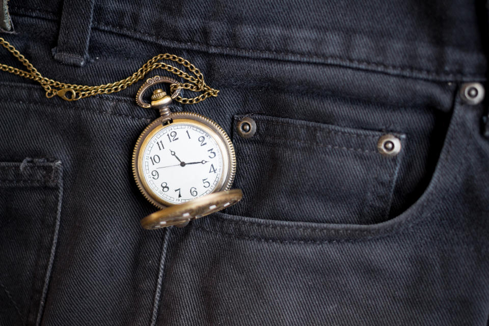 vintage pocket watch in pocket black jean