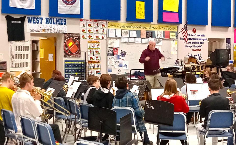 Brian W. Dodd directs the West Holmes band during rehearsal for the band's final road trip to Nashville over spring break.