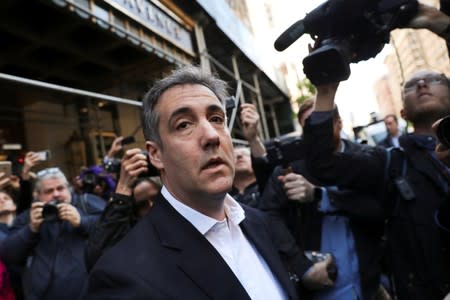 FILE PHOTO: Michael Cohen, U.S. President Donald Trump's former lawyer, leaves his apartment to report to prison in Manhattan