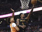 Toronto Raptors forward Rondae Hollis-Jefferson (4) scores as Phoenix Suns forward Cameron Johnson (23) defends during the second half of an NBA basketball game Friday, Feb. 21, 2020, in Toronto. (Frank Gunn/The Canadian Press via AP)