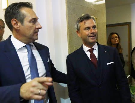 Head of the Austrian Freedom Party (FPOe) Heinz-Christian Strache (L) and Austrian presidential candidate Norbert Hofer leave their final election rally in Vienna, Austria, December 2, 2016. REUTERS/Leonhard Foeger