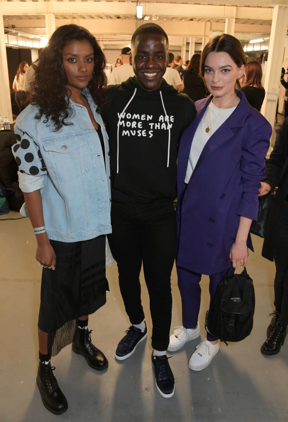 <p>This look was from London Fashion Week in 2019, but we are still very here for it. Big yes to the polka dot denim and classic boots + midi skirt combo.</p>