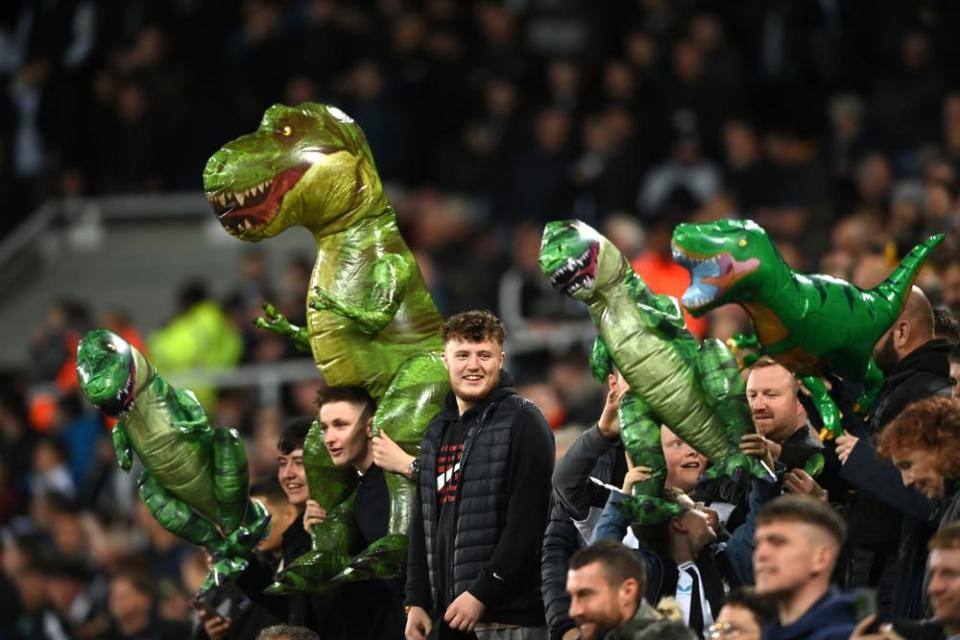 Newcastle United fans carry T-Rex inflatables to taunt the Everton goalkeeper Jordan Pickford. The former Sunderland man was previously involved in a pub brawl after rival fans mocked him for having short arms