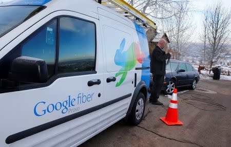 A technician gets cabling out of his truck to install Google Fiber in a residential home in Provo, Utah, January 2, 2014. REUTERS/George Frey