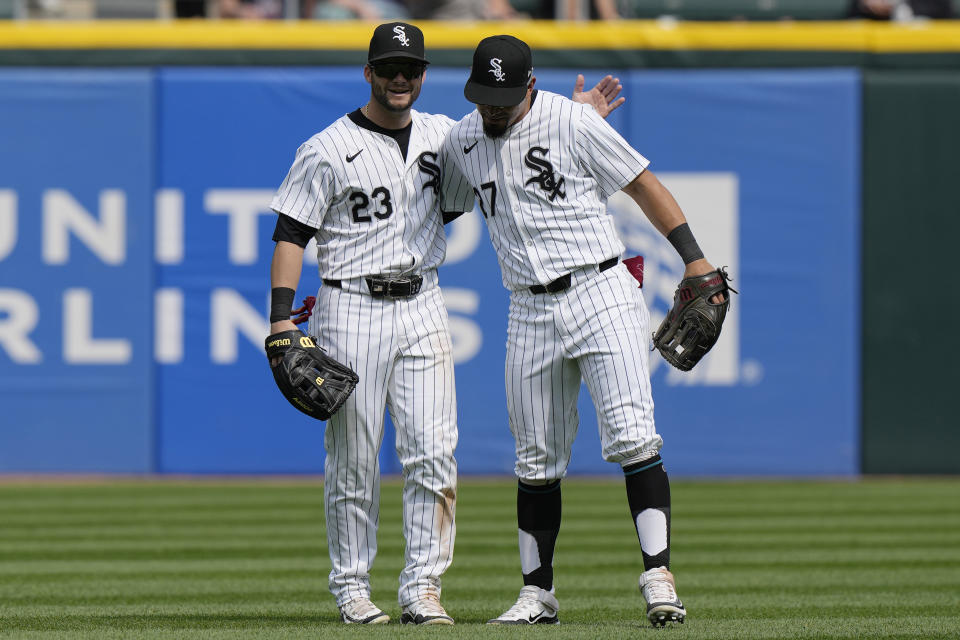Chicago White Sox's Andrew Benintendi, left, celebrates with Rafael Ortega after the White Sox defeated the Tampa Bay Rays in a baseball game in Chicago, Sunday, April 28, 2024. (AP Photo/Nam Y. Huh)