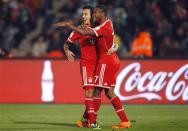 Thiago (L) of Germany's Bayern Munich celebrates his goal against Morocco's Raja Casablanca with his team mate David Alaba during their 2013 FIFA Club World Cup final match at Marrakech stadium December 21, 2013. REUTERS/Amr Abdallah Dalsh