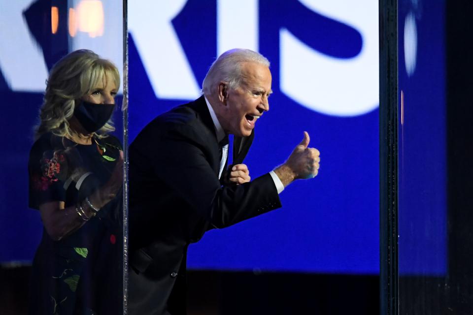 US President-elect Joe Biden with his wife Jill Biden, gives a thumbs up on stage after delivering remarks in Wilmington, Delaware, on November 7, 2020, and being declared the winner of the US presidential election. (Photo by Roberto SCHMIDT / AFP) (Photo by ROBERTO SCHMIDT/AFP via Getty Images)