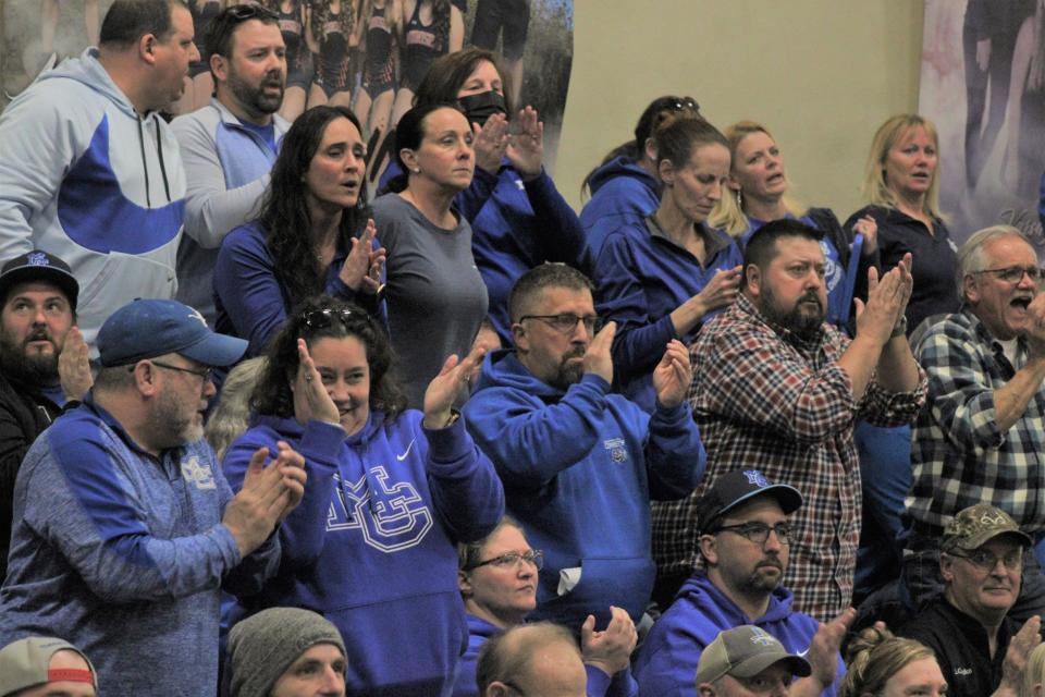 Mackinaw City supporters cheer on the Lady Comets during the second half on Tuesday.