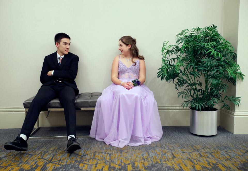 Josiah Reeves, left, and Bailey Piepenhagen hang out in a quiet corner during A Starry Night prom April 13 at the Hilton Appleton Paper Valley hotel in downtown Appleton.