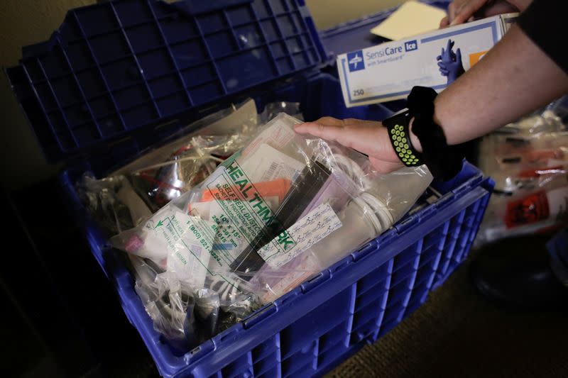 Protective equipment and other items are seen in the supplies of Harborview Medical Center's home assessment team during preparations to visit the home of a person potentially exposed to novel coronavirus at Harborview Medical Center in Seattle