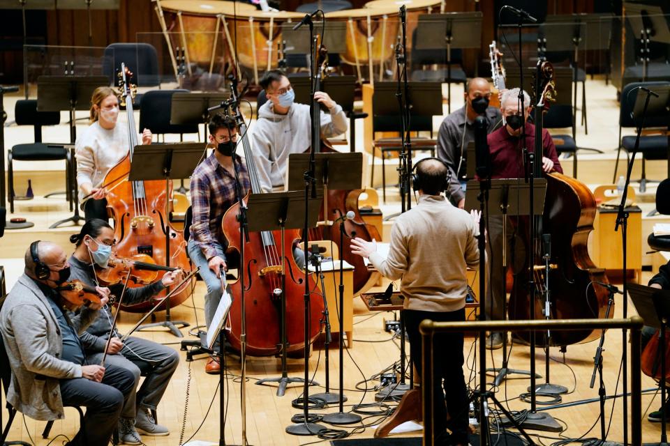 Conductor Daniel Slatkin, works on a score with the Detroit Symphony Orchestra for the documentary 'Gradually, Then Suddenly: The Bankruptcy of Detroit' at the DSO in Detroit on Dec. 6, 2021.