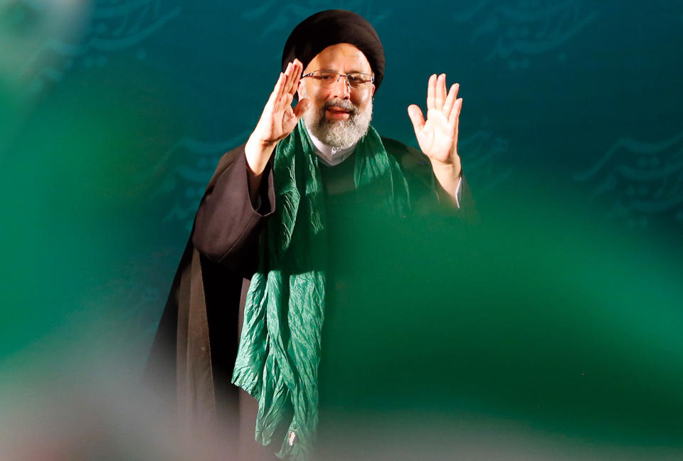 <p>Iranian conservative presidential candidate Ebrahim Raisi greets his supporters as he arrives during an election campaign rally in Tehran, Iran, May 16, 2017. Conservative presidential candidate Ebrahim Raisi is the main contender against president Hassan Rouhani in the upcoming presidential election. Iranians will go to the poll for the presidential election on May 16, 2017. (Photo: Abedin Taherkenareh/EPA) </p>