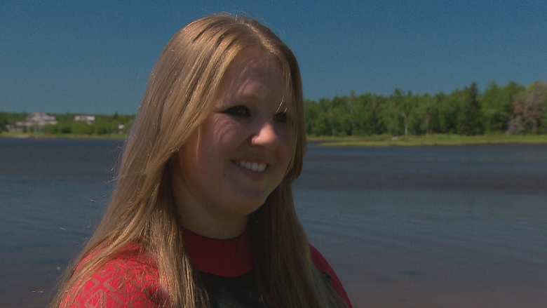 Eelgrass destined for destruction is moved up the Shediac River