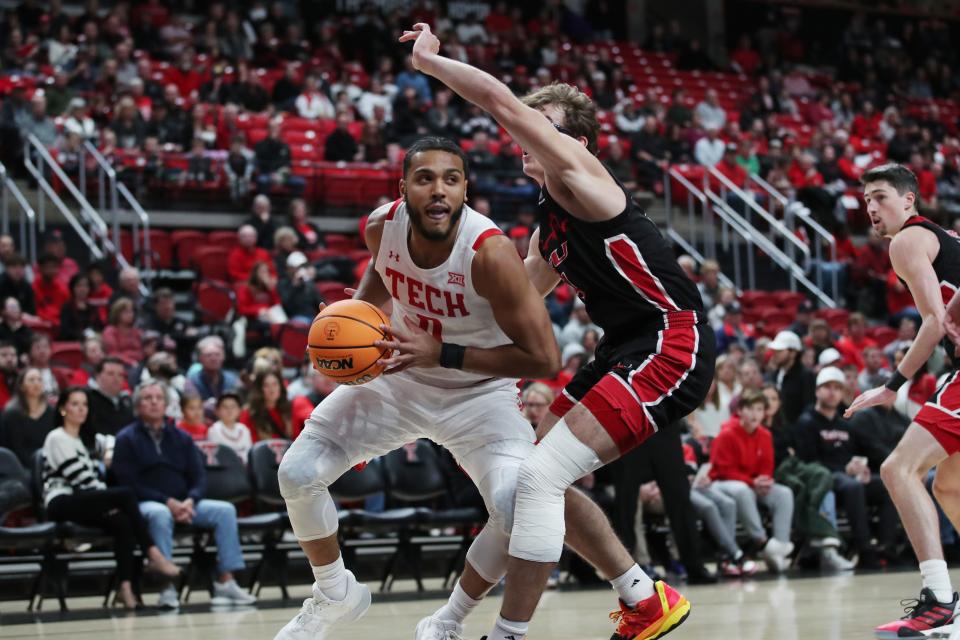 Dec 13, 2022; Lubbock, Texas, USA; Texas Tech Red Raiders forward Kevin Obanor (0) works the ball against Eastern Washington Eagles forward Casey Jones (31) in the first half at United Supermarkets Arena. Mandatory Credit: Michael C. Johnson-USA TODAY Sports ORG XMIT: IMAGN-500888 ORIG FILE ID:  20221213_jcd_aj7_0143.JPG
