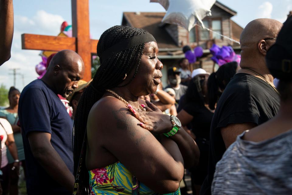 Queen Diane Owens of Detroit says a prayer during a community vigil or Wynter Cole Smith of Lansing, 2, on Erwin Avenue near Wynter Cole Smith of Lansing, 2, was found in Detroit on Thursday, July 6, 2023.