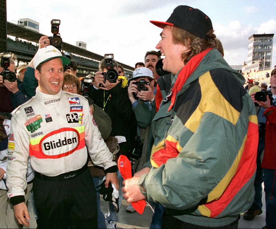 Scott Brayton reacts to team owner John Menard in the pit area after setting a new four lap track record and securing the pole for the 80th running of the Indianapolis 500 in 1996.  Brayton was killed in practice just a few days later.