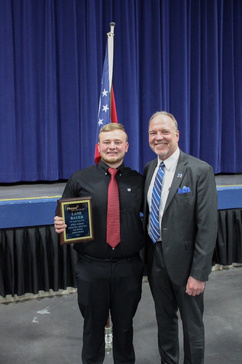 Lane Bauer, the 2023 Byron H. Carmean Award winner, with Pioneer Superintendent Greg Nickoli.