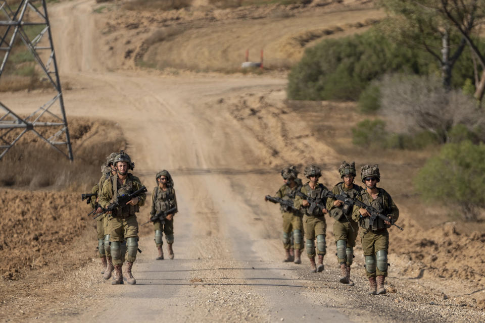 Israeli soldiers are seen near the Gaza Strip border in southern Israel, Thursday, June 13, 2024. The army is battling Palestinian militants across Gaza in the war ignited by Hamas' Oct. 7 attack into Israel. (AP Photo/Ohad Zwigenberg)