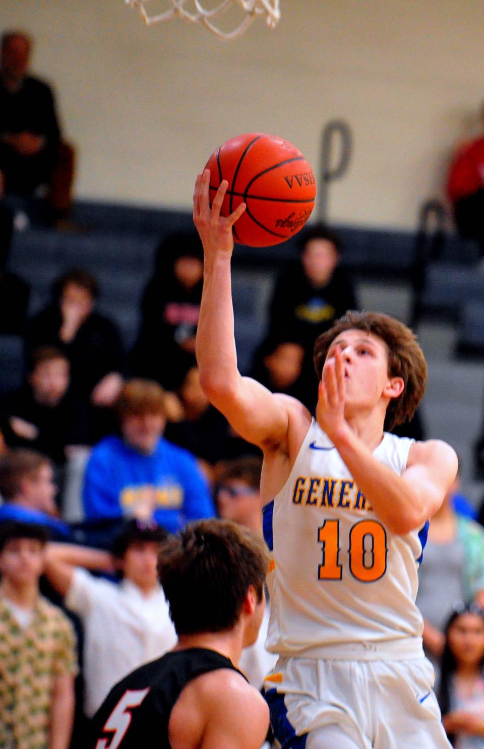 Wooster's Brady Bowen drives to the hoop.