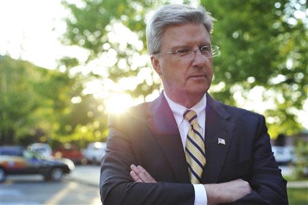 Challenger Bryan Smith listens to questions from the media after his debate with incumbent Congressman Mike Simpson (R-ID) outside the studios of Idaho Public Television in Boise, Idaho May 11, 2014. REUTERS/Patrick Sweeney