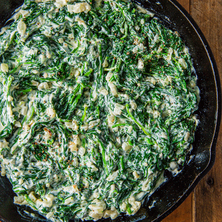 <p>Creamed spinach is a simple side dish that is also the perfect way to use up an abundance of dying spinach. The creaminess pairs perfectly with whatever you serve on the holiday and will make you (and your vegetarian guests) forget you're eating greens!<br><br>Get the <strong><a href="https://www.delish.com/cooking/recipe-ideas/a28510710/easy-creamed-spinach-recipe/" rel="nofollow noopener" target="_blank" data-ylk="slk:Creamed Spinach recipe;elm:context_link;itc:0;sec:content-canvas" class="link ">Creamed Spinach recipe</a></strong>.</p>