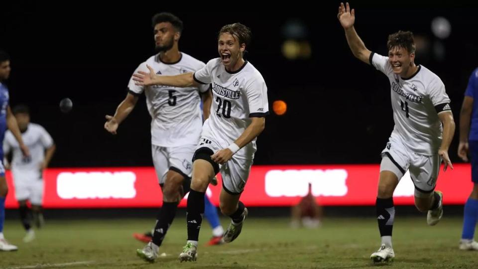 Parker Forbes (20), Mason Tatafu (5) and Bryce LeBel (4) celebrate during Louisville’s 4-2 win over Kentucky on Tuesday night in Louisville.