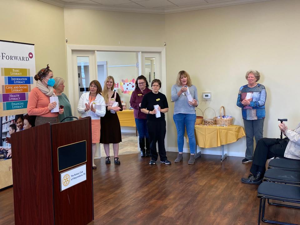 Alexander Hamilton Memorial Free Library staff members received travel mugs saying ‘This ain’t your Granny’s Library!’ at an Oct. 18 celebration of the Waynesboro library’s recognition by the PA Forward program of the Pennsylvania Library Association.