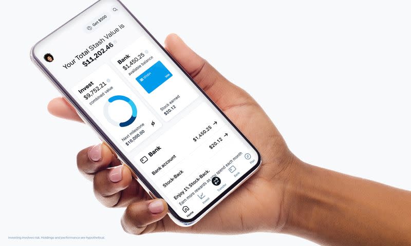 Stash's stock trading app is seen on a phone