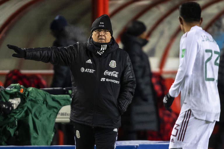 Mexico coach Gerardo "Tata" Martino directs his team during a FIFA World Cup qualifying soccer match against Canada, Tuesday, Nov. 16, 202, in Edmonton, Alberta. (Jason Franson/The Canadian Press via AP)