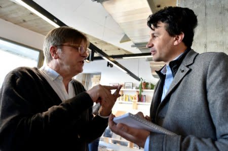 ALDE President and Former Belgium Prime Minister Guy Verhofstadt chats with Reuters journalist Peter Maushagen during the kick-off campaign of La Republique En Marche Benelux, in Brussels, Belgium, April 7, 2018. Picture taken April 7, 2018. REUTERS/Eric Vidal