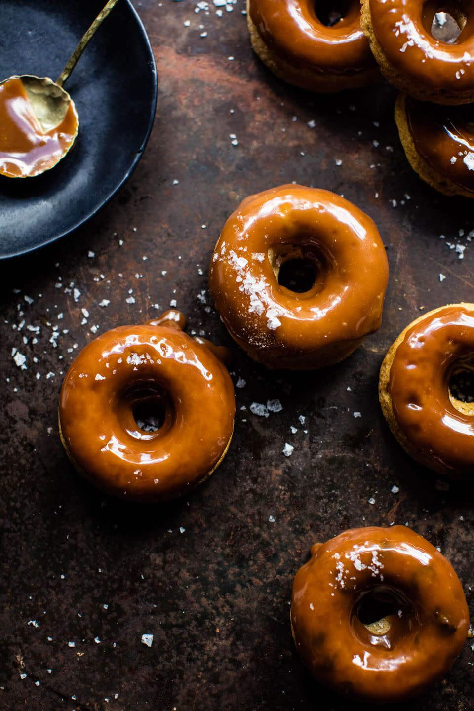<p>Warning: The cider caramel glaze is so good, you'll be eating it straight from the bowl. You'll definitely have to make more than one batch.</p><p><strong>Get the recipe at <a href="https://www.halfbakedharvest.com/baked-salted-caramel-apple-cider-doughnuts/" rel="nofollow noopener" target="_blank" data-ylk="slk:Half Baked Harvest;elm:context_link;itc:0;sec:content-canvas" class="link ">Half Baked Harvest</a>.</strong></p><p><strong><strong><a class="link " href="https://go.redirectingat.com?id=74968X1596630&url=https%3A%2F%2Fwww.wayfair.com%2Fkitchen-tabletop%2Fpdp%2Ffox-run-brands-nonstick-donut-pan-fru1087.html&sref=http%3A%2F%2Fwww.countryliving.com%2Ffood-drinks%2Fg28172487%2Fapple-cider-donuts%2F" rel="nofollow noopener" target="_blank" data-ylk="slk:SHOP DOUGHNUT PANS;elm:context_link;itc:0;sec:content-canvas">SHOP DOUGHNUT PANS</a></strong><br></strong></p>